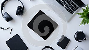 Flatlay of Black Tech Gadgets and Accessories on White Background