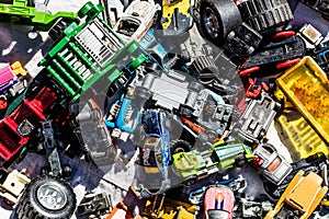 Flatlay of car toys at garage sale for over-consumption