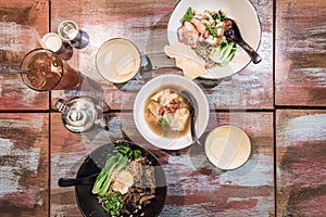 Flatlay of Chinese wanton dumpling noodle dishes