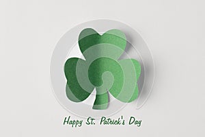 Flatlay close up view photo image of green clover leaf isolated white color backdrop with congrats text