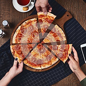 Flatlay. Friends eat pizza.