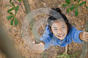 Flatlay Little girl have fun playing climb tree