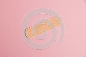 Flatlay, medical bactericidal patch on a pink background