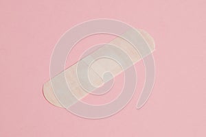 Flatlay, medical bactericidal patch on a pink background