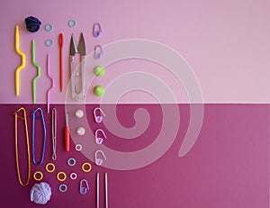 Flatlay of must-have knitting,crochet, sewing tools or accessories with threads