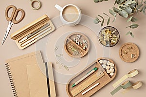 Flatlay of office supplies made of recycled materials on beige background