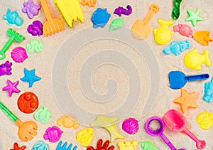 Flatlay playground, sandbox and multi-colored plastic toys.