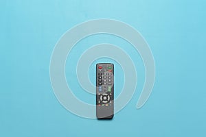 Flatlay of Tv remote isolate on cyan background