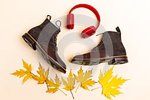 Flatlay of Upper View of Premium Dark Brown Grain Brogue Derby Boots Made of Calf Leather with Rubber Sole Placed With Headphones