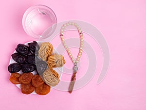Flatley with rosaries, sweets, dates. The Concept Of Ramadan
