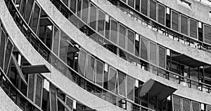 Flats at The Barbican Centre, London, UK, showing post-war Brutalist style architecture. Photographed from street level in monochr