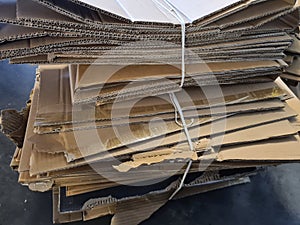 Flattened cardboard boxes stacked randomly