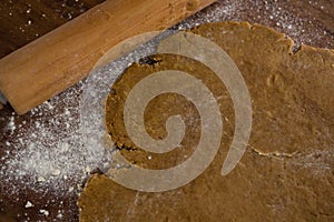 Flattened dough on a wooden table