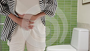 Flatulence woman, hand hold on stomach from ache, suffer from food poisoning, abdominal pain, colon problem, gastritis, diarrhea,