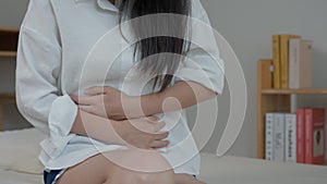 Flatulence woman, hand hold on stomach from ache, suffer from food poisoning, abdominal pain, colon problem, gastritis, diarrhea,