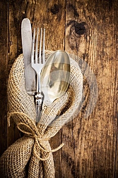 Flatware the old wooden table with a rustic style.