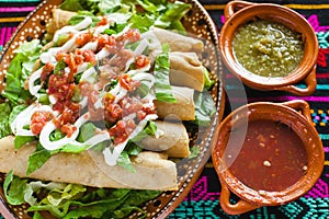 Flautas de pollo tacos and Salsa Homemade food Mexican mexico city