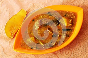 flavorful bowl of dalcha, a hyderabadi specialty. lentil stew. mango. vegetables. spicy. photo