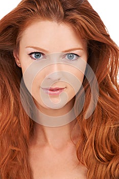 Flawless perfection. Closeup of a gorgeous redhead with flawless complexion gazing at the camera.