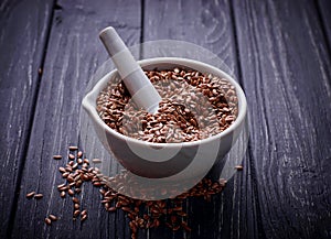 Flax seeds in pounder photo