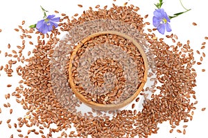 flax seeds in wooden bowl with flower isolated on white background. flaxseed or linseed. Cereals. top view