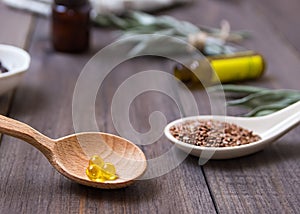 Flaxseed oil in caps on a wooden background. Phytotherapy.