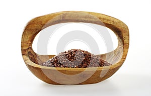 Flaxseed in a wooden bowl.