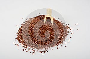Flaxseed with a wooden spoon.