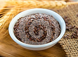 Flaxseeds in white bowl