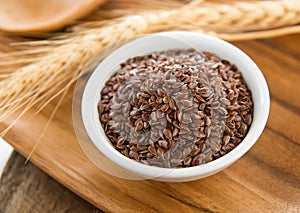 Flaxseeds in white bowl