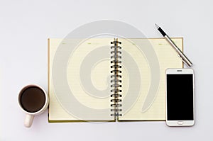Flay lay space on the desk Area space enter text. mockup coffee cups, Pen note paper Placed on a White table wood
