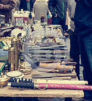 Flea market booth with many old items being sold.