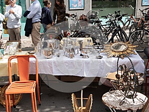Flea market details. Objects for sale presented on a table.