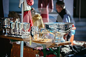 Flea market: Dishes and dinnerware in the foreground, people in the blurry background