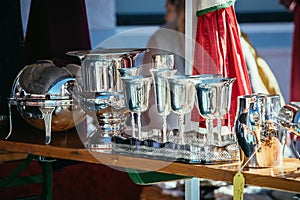 Flea market: Dishes and dinnerware in the foreground, people in the blurry background