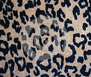 Fleecy brown leopard skin fabric background