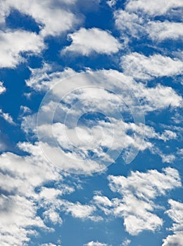 Fleecy clouds on blue sky