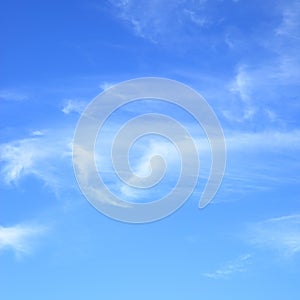 Fleecy clouds in blue sky photo