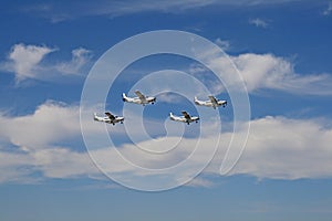 FLEET OF CESSNA CARAVANS AGAINST THE SKY