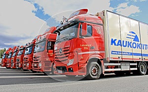 Fleet of Red Long Haulage Trucks