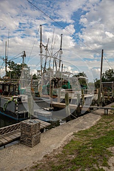 Fleet of shrimping boats docked along a river in Florida