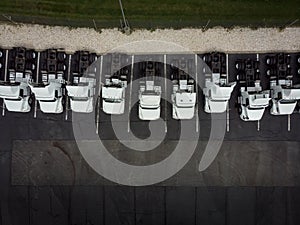 Fleet of white 18 wheeler freight semi-trucks