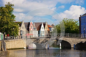 Flemish houses and bridge over canal in Brugge