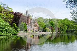 Flemish style building reflecting in Minnewater lake