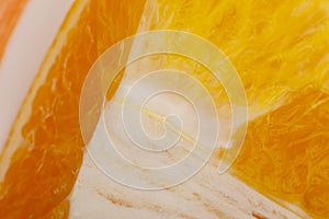 Flesh of juicy ripe orange as background or backdrop, close-up abstract blurred image