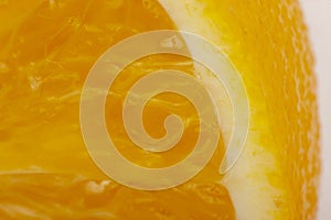 Flesh of juicy ripe orange as background or backdrop, close-up abstract blurred image