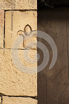 Fleur-de-lis carved in stone in an old house