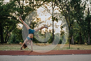 Flexibility and Strength in Nature: Girl Show Off Athletic Skills with 360 Degree Cartwheels