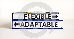 Flexible or adaptable symbol. Concept word Flexible Adaptable on beautiful books. Beautiful white table white background. Business