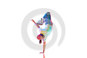 Flexible, artistic young man, hip hop, breakdancer in motion, performing isolated over white studio background in neon